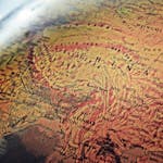 Explore the intricate details of China and neighboring regions in this vintage-style globe photo.